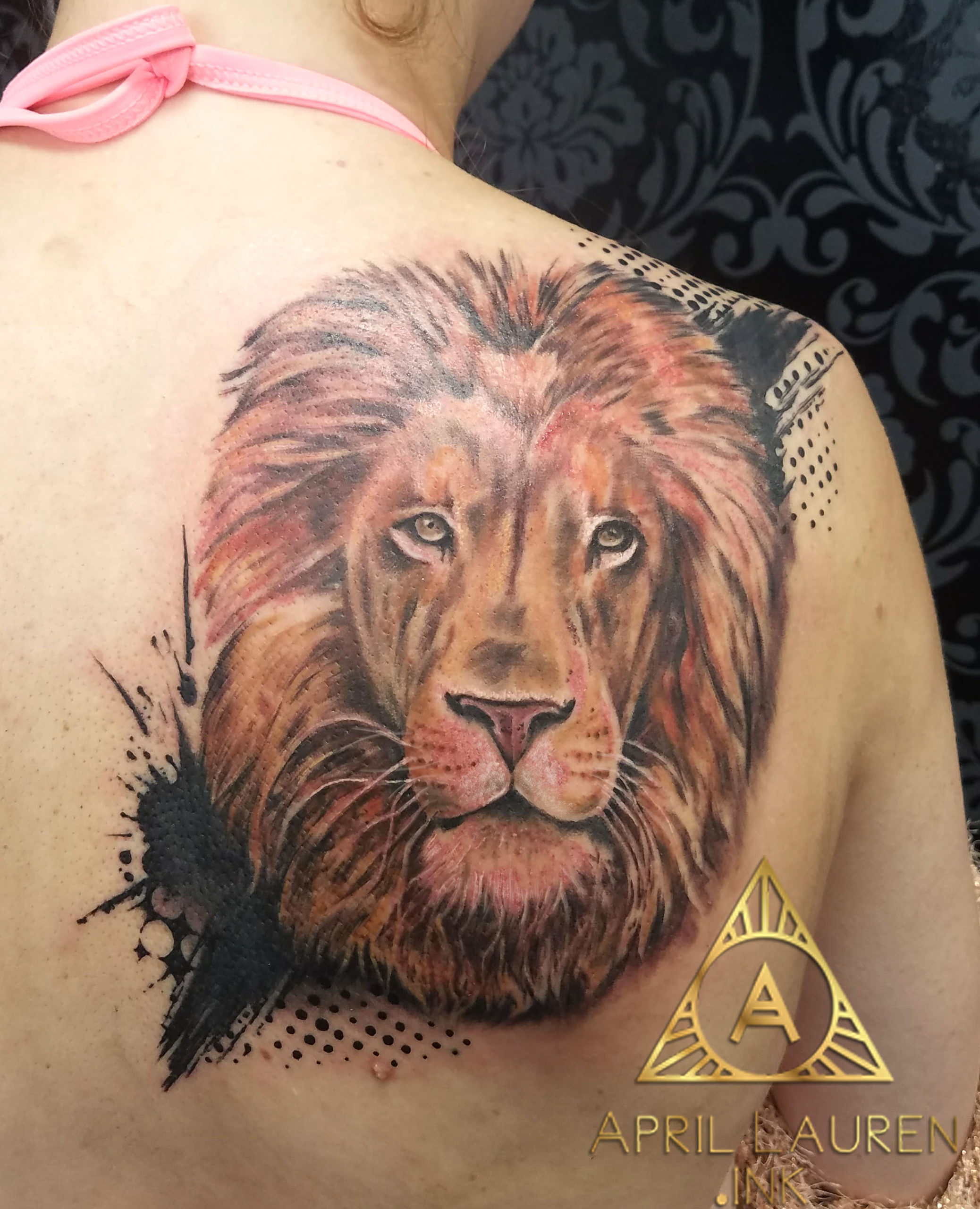 Realistic Lion portrait tattoo on back
