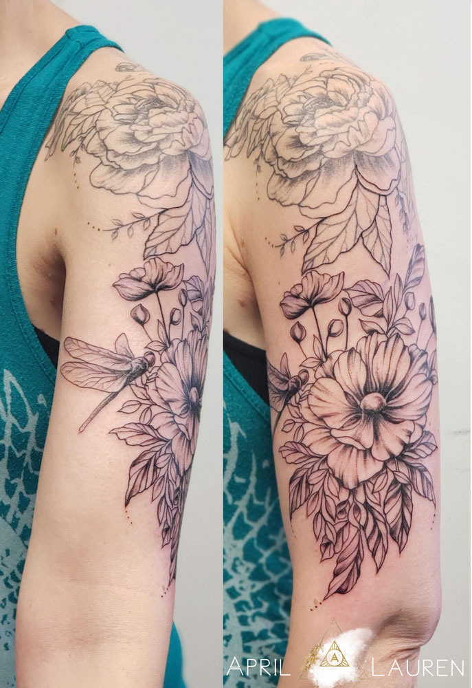black and grey floral tattoo with flowers and leaves
