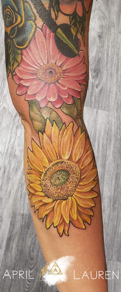 pink and yellow sun flower tattoo by April Lauren at Naya Studio